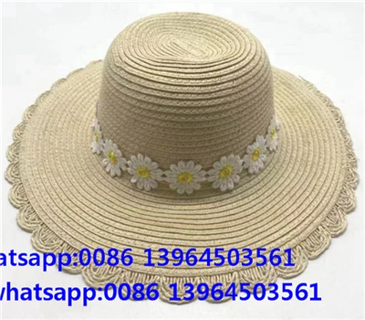 Cappello da donna in paglia di carta intrecciata a tesa larga con nastro a margherita